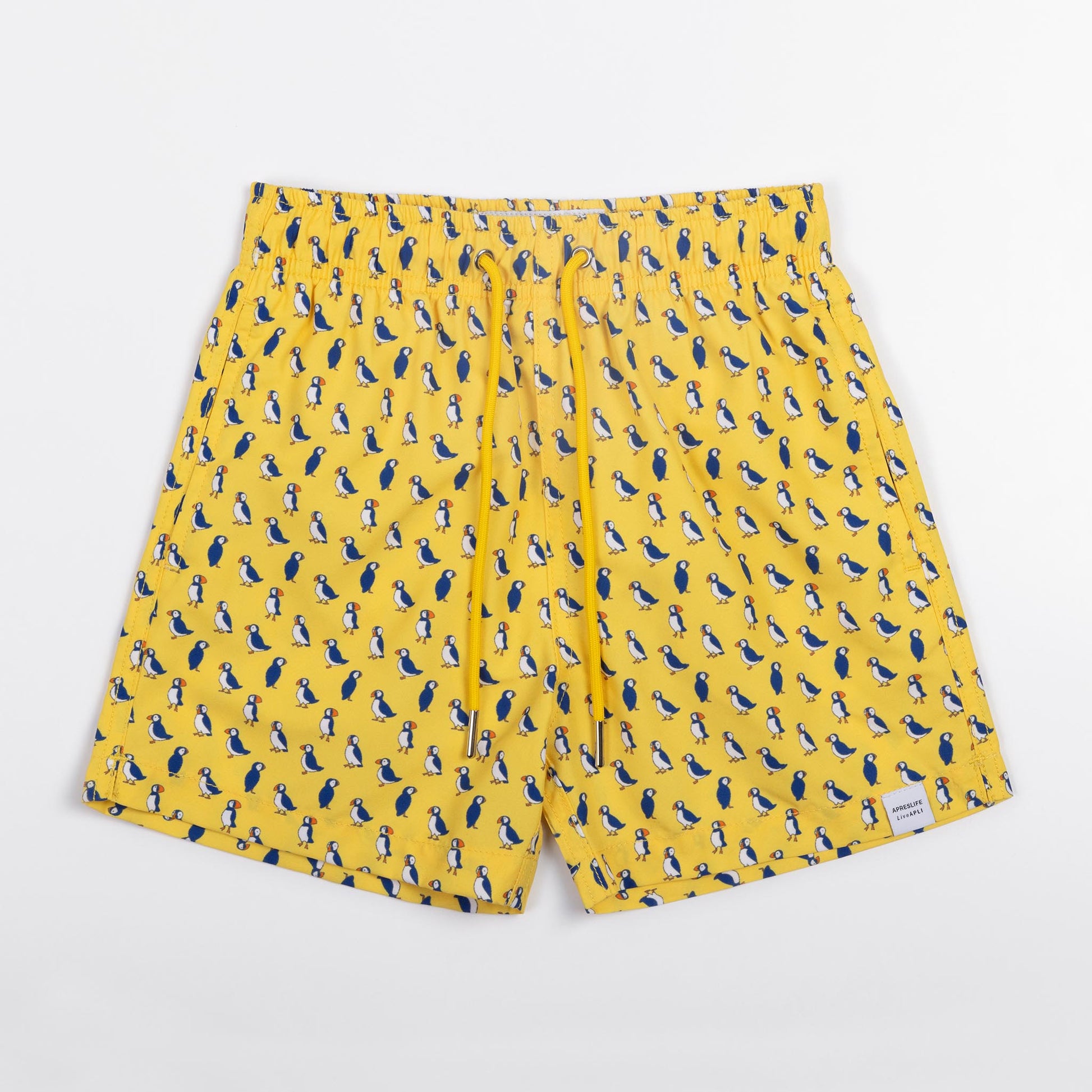 KIDS SWIM SHORTS KIDS PUFFINS in color YELLOW - Front shot